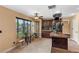 Kitchen with natural lighting, featuring wooden cabinets and tiled flooring at 8208 Fritzen Ave, Las Vegas, NV 89131
