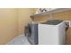 Clean laundry room featuring a side-by-side washer and dryer on tile floor at 8208 Fritzen Ave, Las Vegas, NV 89131