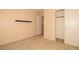 Bright bedroom with a wall shelf, and closet offering ample storage space at 8842 Duncan Barrel Ave # 101, Las Vegas, NV 89178