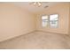 Cozy bedroom features neutral walls and plush carpet, offering a serene retreat at 8842 Duncan Barrel Ave # 101, Las Vegas, NV 89178
