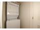 A modern, stacked washer and dryer set optimizing space and laundry convenience at 8842 Duncan Barrel Ave # 101, Las Vegas, NV 89178