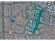 Aerial view of a residential community with winding streets, homes, and beautiful lakes at 9028 Cypress Point Way, Las Vegas, NV 89117