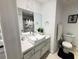 Bright bathroom with a white vanity, vessel sink, modern fixtures, and a clean, minimalist design at 9028 Cypress Point Way, Las Vegas, NV 89117
