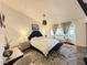 Cozy bedroom featuring soft natural light and a neutral color scheme, creating a serene and relaxing atmosphere at 9028 Cypress Point Way, Las Vegas, NV 89117