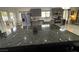 Bright kitchen with stainless steel appliances and stone countertops at 9028 Cypress Point Way, Las Vegas, NV 89117