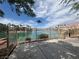 A scenic view of the lakefront community, featuring lush landscaping and serene waters at 9028 Cypress Point Way, Las Vegas, NV 89117