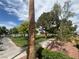 Enjoy a walk through the neighborhood's peaceful park with scenic views and lush greenery at 9028 Cypress Point Way, Las Vegas, NV 89117
