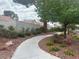 Beautifully landscaped sidewalk in a quiet neighborhood with colorful flowers and charming shrubs at 9028 Cypress Point Way, Las Vegas, NV 89117