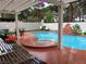 Stunning pool area with a spa, rock waterfall, and plenty of seating for outdoor entertaining at 9028 Cypress Point Way, Las Vegas, NV 89117