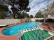 Backyard oasis with a pool, spa, water feature, and games, perfect for outdoor fun and entertaining at 9028 Cypress Point Way, Las Vegas, NV 89117