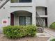 Attractive condo building with a small, well-maintained front garden and stairs to upper levels at 950 Seven Hills Dr # 114, Henderson, NV 89052