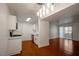Stylish kitchen with stainless steel appliances, marble counters and hardwood floors that opens to living area at 950 Seven Hills Dr # 114, Henderson, NV 89052