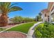 Lush backyard with green turf, mature trees, and well-maintained landscaping at 9916 Netherton Dr, Las Vegas, NV 89134