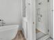 Freestanding tub and glass shower in a modern bathroom at 9916 Netherton Dr, Las Vegas, NV 89134