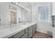 Bathroom with dual vanity and large mirror at 9916 Netherton Dr, Las Vegas, NV 89134