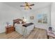 Bedroom features a ceiling fan and window with shutters at 9916 Netherton Dr, Las Vegas, NV 89134