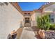 Inviting courtyard entrance featuring a decorative gate and manicured landscaping elements at 9916 Netherton Dr, Las Vegas, NV 89134