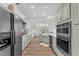 Open-concept kitchen features stainless appliances, and generous counter space with easy access to the dining area at 9916 Netherton Dr, Las Vegas, NV 89134