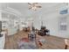 Open-concept living room with recessed lighting, wood floors, and seamless flow to the kitchen and dining area at 9916 Netherton Dr, Las Vegas, NV 89134