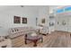 Bright and airy living room with a comfortable sofa and accent chair at 9916 Netherton Dr, Las Vegas, NV 89134