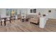 Spacious living room with wood-style floors and comfortable seating arrangement at 9916 Netherton Dr, Las Vegas, NV 89134