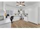 Bright home office with custom built-ins, wood flooring, and ample workspace at 9916 Netherton Dr, Las Vegas, NV 89134