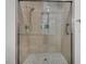 Shower stall with glass door and tile surround at 9916 Netherton Dr, Las Vegas, NV 89134