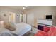 Bedroom with ensuite bathroom and closet featuring plush carpet, and a comfortable bed and futon at 10001 Peace Way # 2231, Las Vegas, NV 89147