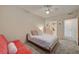 Bedroom featuring plush carpet, a comfortable bed and futon with access to an ensuite bathroom at 10001 Peace Way # 2231, Las Vegas, NV 89147