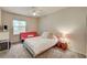 Well-lit bedroom with ceiling fan, plush carpet, and a comfortable bed and futon at 10001 Peace Way # 2231, Las Vegas, NV 89147