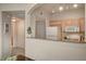 A kitchen pass through featuring a granite countertop and white appliances at 10001 Peace Way # 2231, Las Vegas, NV 89147