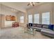 This living room features an open floor plan, comfortable seating, and ample natural light at 10001 Peace Way # 2231, Las Vegas, NV 89147