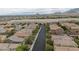 A birds-eye view shows the home's location in the planned community including the street and the surrounding houses at 10617 Hartford Hills Ave, Las Vegas, NV 89166