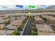 An aerial view of a residential neighborhood highlights the home's location and neighborhood amenities at 10617 Hartford Hills Ave, Las Vegas, NV 89166
