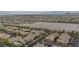 Expansive aerial view showcases a well-planned community and highlights the neighborhood's layout and surroundings at 10617 Hartford Hills Ave, Las Vegas, NV 89166