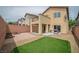 The backyard has a mix of concrete, gravel, and grass, offering a flexible outdoor space at 10617 Hartford Hills Ave, Las Vegas, NV 89166