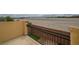 An outdoor balcony overlooks desert landscape providing serene views and a private retreat for relaxation at 10617 Hartford Hills Ave, Las Vegas, NV 89166