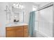 Clean bathroom with a shower-tub combination, ample counter space, and bright lighting at 10617 Hartford Hills Ave, Las Vegas, NV 89166