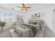 Sunlit bedroom featuring stylish decor, a ceiling fan, and ample natural light at 10617 Hartford Hills Ave, Las Vegas, NV 89166