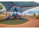 A vibrant community playground with covered seating and shaded play structures, perfect for Gathering fun and recreation at 10617 Hartford Hills Ave, Las Vegas, NV 89166
