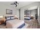 Well-lit bedroom featuring ceiling fan, large closet mirror and tasteful decor, creating a comfortable and inviting space at 1112 Observation Dr # 201, Las Vegas, NV 89128