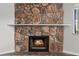 A close-up of the stone fireplace with a mantel, perfect focal point for a cozy room at 1112 Observation Dr # 201, Las Vegas, NV 89128