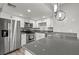 Bright kitchen with stainless steel appliances, plenty of counter space, and white cabinets at 1112 Observation Dr # 201, Las Vegas, NV 89128