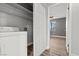 View of a laundry room with washer, dryer, and shelves for optimal organization at 1112 Observation Dr # 201, Las Vegas, NV 89128