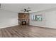 Open living area with a stone fireplace and neutral walls, plus lots of sunlight at 1112 Observation Dr # 201, Las Vegas, NV 89128