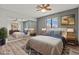 Comfortable main bedroom with mirrored closet doors and an overhead fan at 1112 Observation Dr # 201, Las Vegas, NV 89128