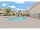 Community pool with clear blue water surrounded by meticulously maintained condos with blue skies above at 1112 Observation Dr # 201, Las Vegas, NV 89128