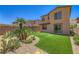 Well-manicured backyard with vibrant artificial grass, desert landscaping, and a private fence at 12546 Mosticone Way, Las Vegas, NV 89141