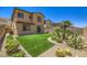 Low maintenance backyard featuring artificial turf, desert landscaping, and a private block wall at 12546 Mosticone Way, Las Vegas, NV 89141