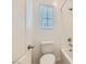 Clean bathroom featuring a toilet, shower/tub combo, and window, offering a practical and functional space at 12546 Mosticone Way, Las Vegas, NV 89141